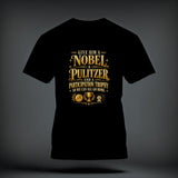 A black t-shirt printed with gold text that reads, Give Him A Nobel, A Pulitzer, And A Participation Trophy, So We Can All Go Home.