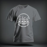 A grey crewneck t-shirt featuring a white graphic of skeletons driving golf carts, encircled by text.