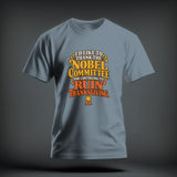 A slate blue t-shirt printed with the text I'D LIKE TO THANK THE NOBEL COMMITTEE FOR CONTINUING TO RUIN THANKSGIVING in yellow, white, and orange.