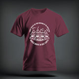 A maroon t-shirt featuring a circular white graphic of the four horsemen in golf carts.