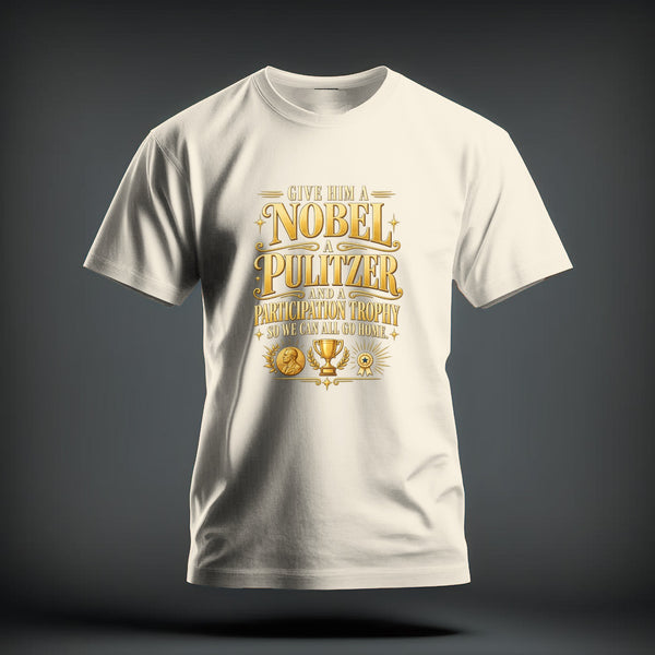 A cream-colored t-shirt with gold graphic text reading "Give him a Nobel, a Pulitzer, and a participation trophy so we can all go home."