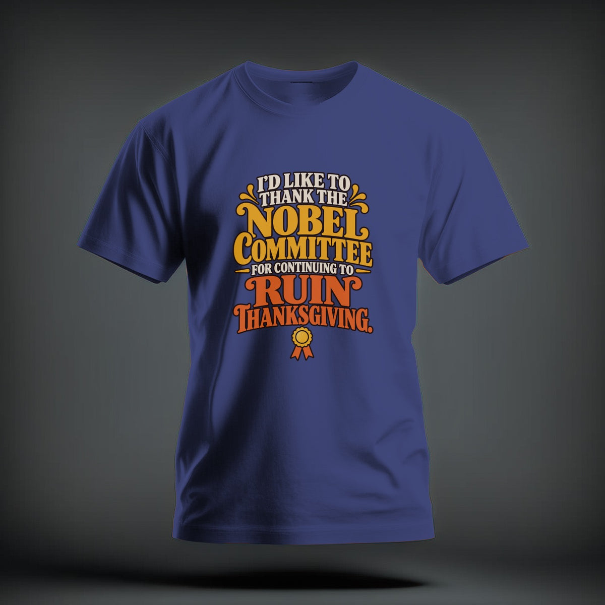 A blue crew neck t-shirt featuring the text "I'd Like To Thank The Nobel Committee For Continuing To Ruin Thanksgiving."