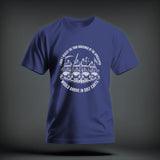 Blue t-shirt featuring a white graphic of the Four Horsemen riding golf carts with humorous text.