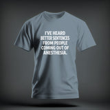 Slate blue short-sleeve t-shirt with white text reading I'VE HEARD BETTER SENTENCES FROM PEOPLE COMING OUT OF ANESTHESIA.