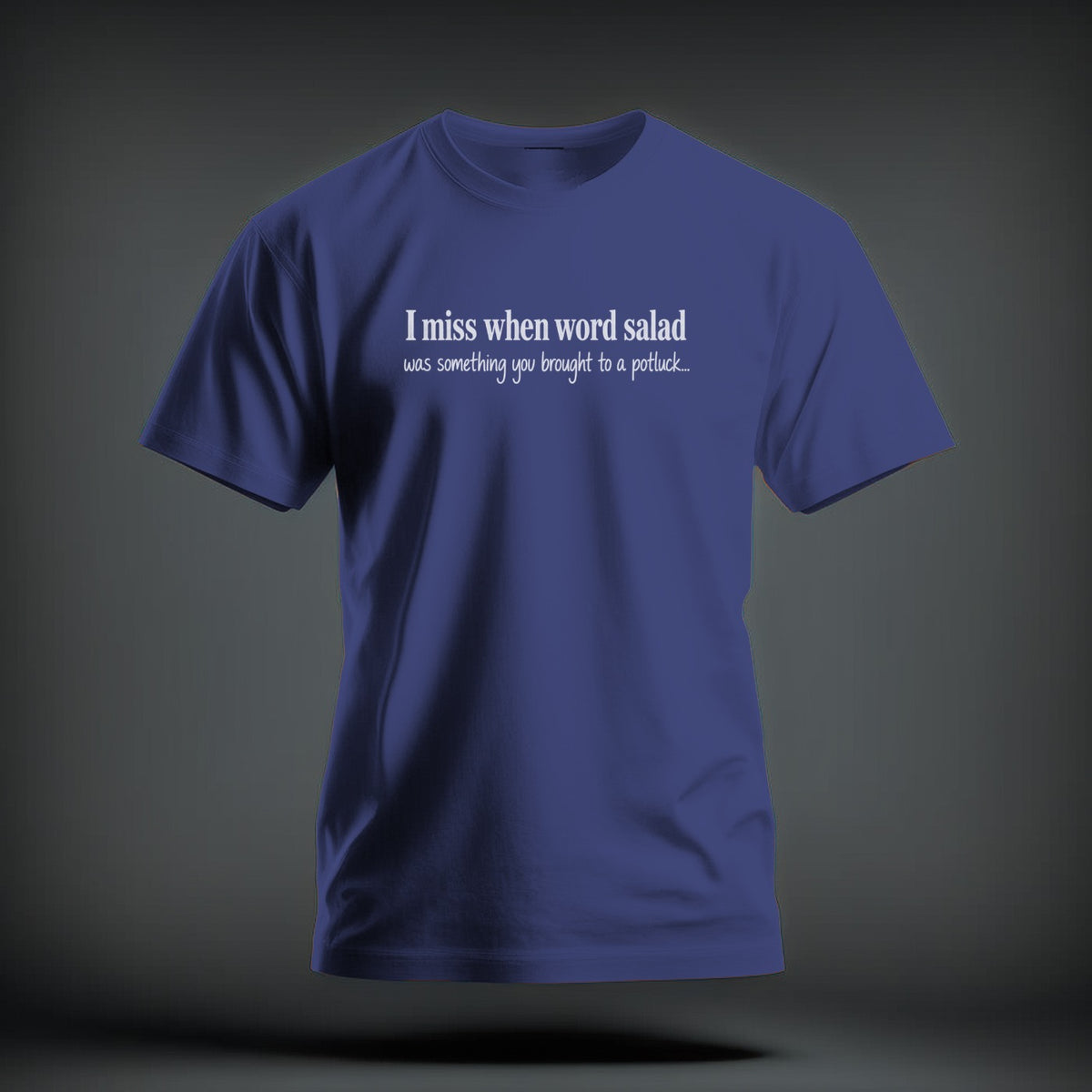 A blue crewneck t-shirt featuring the white text "I miss when word salad was something you brought to a potluck...".